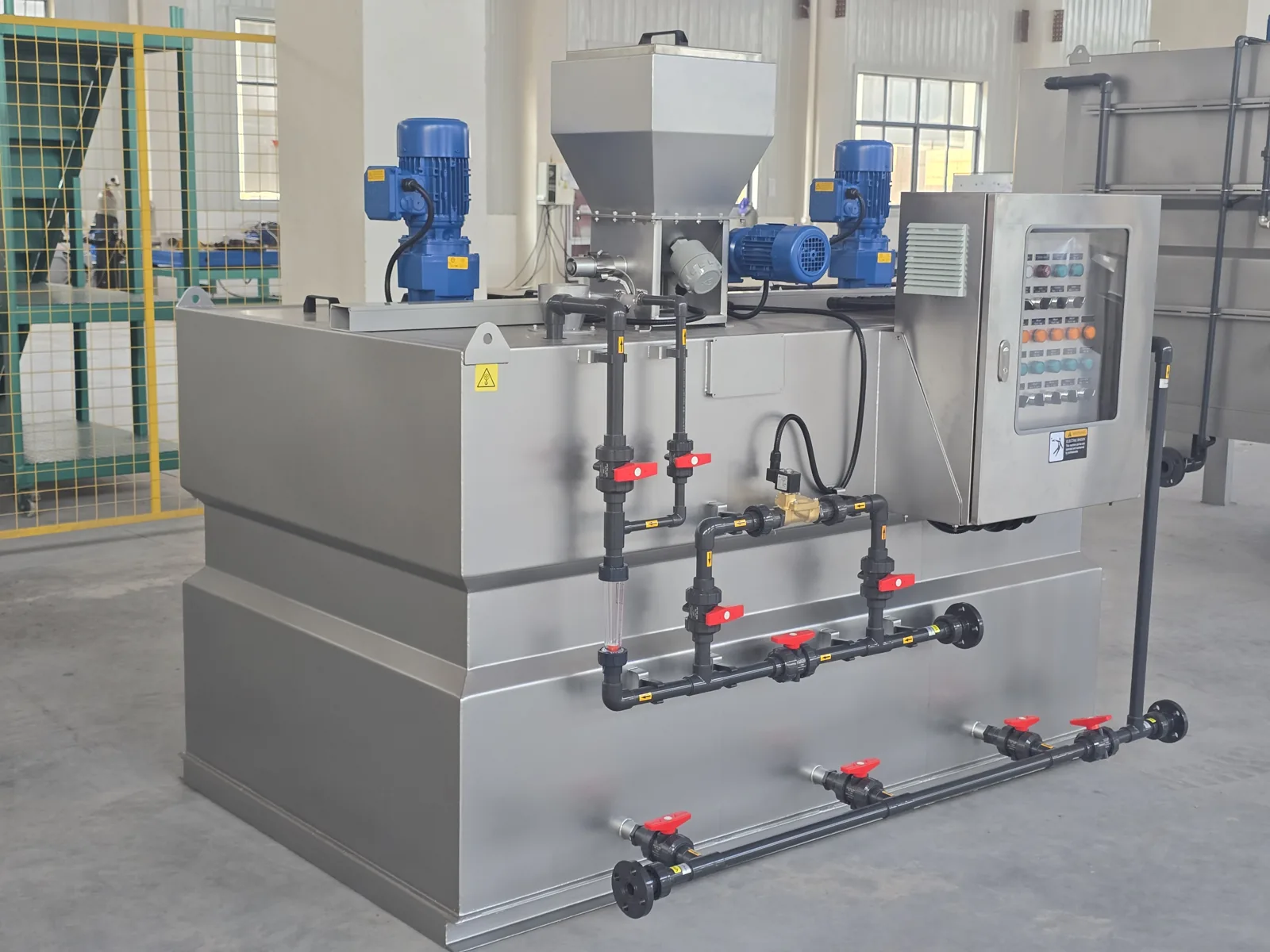 Polymer preparation package showing hopper, mixers and inlet pipework