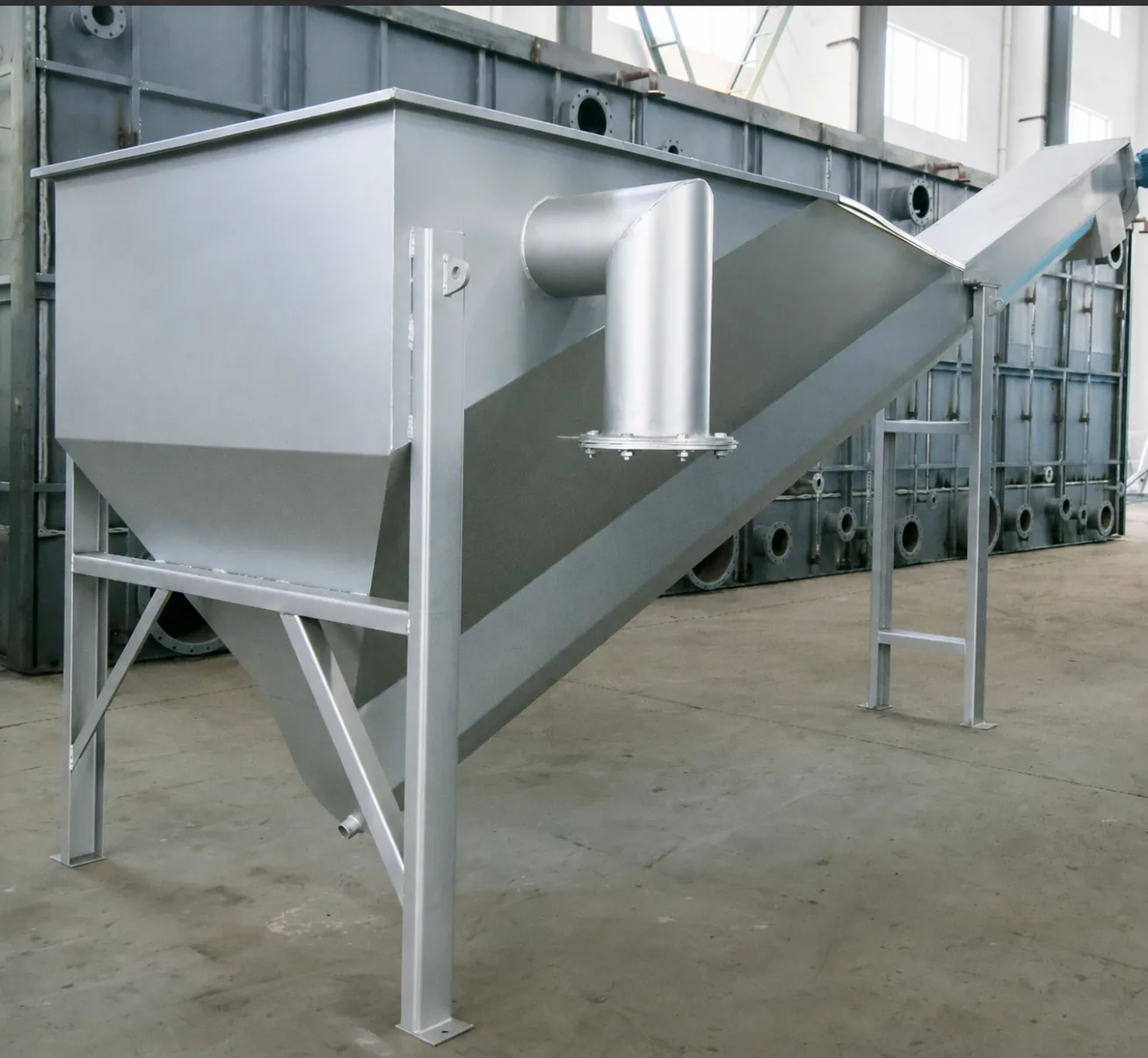 Sand-water separator tank and outlet pipe, front view