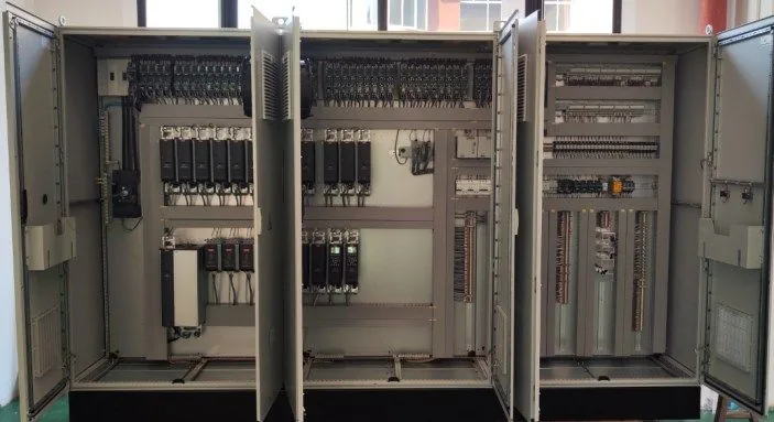 Open electrical control cabinets showing drives and wiring