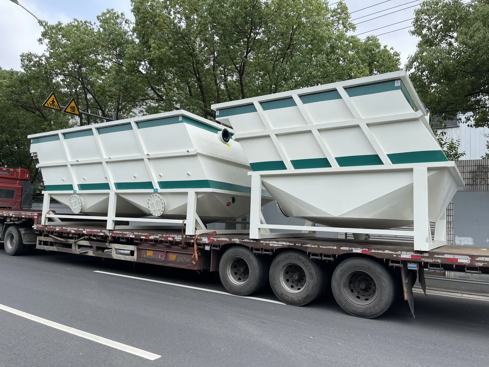 White and green lamella clarifiers ready for transport
